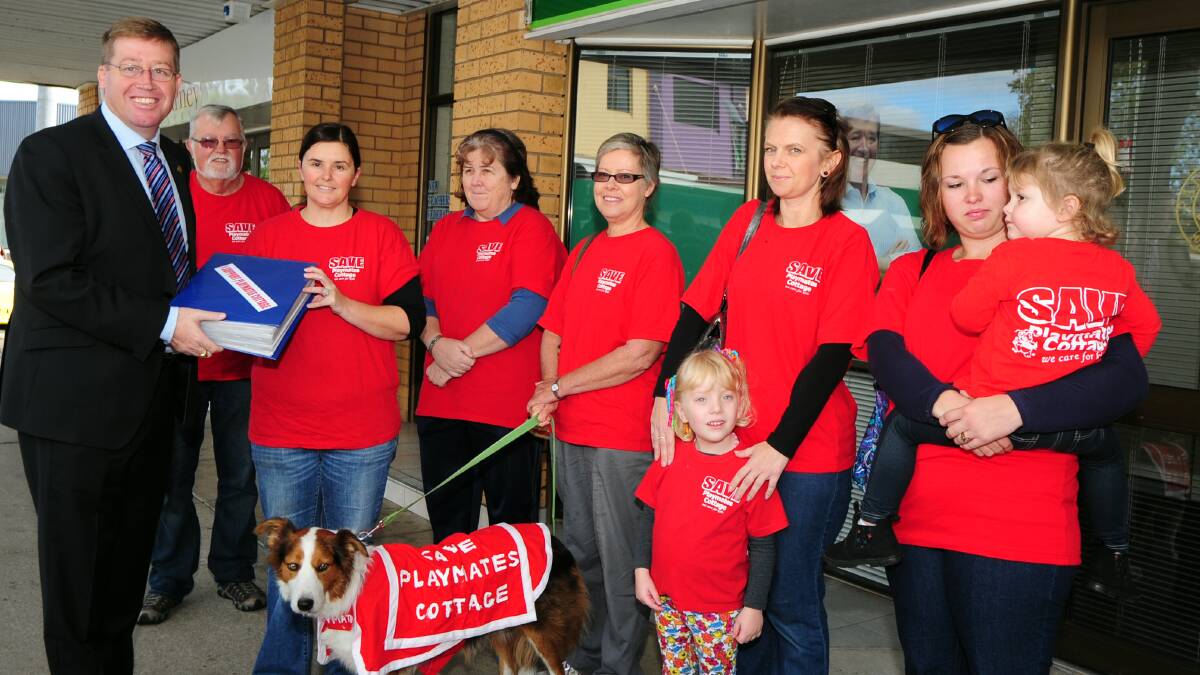 Troy Grant MP receives the petition of Save Playmates Cottage from Phil Priest, Christine Castlehouse, Virginia Morley, Annette Priest, Gem, Mel Cox, Sophie Cox, Aimee Sorensen and Sophie Sorensen. 																         Photo: BELINDA SOOLE