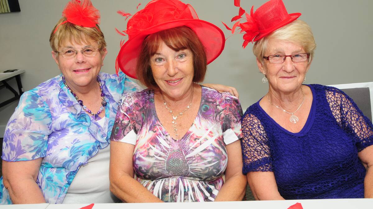 RED HAT LADIES: Isla Nelson, Cheryl Tonkin and Dawn Miller.  Photo: JOSH HEARD.