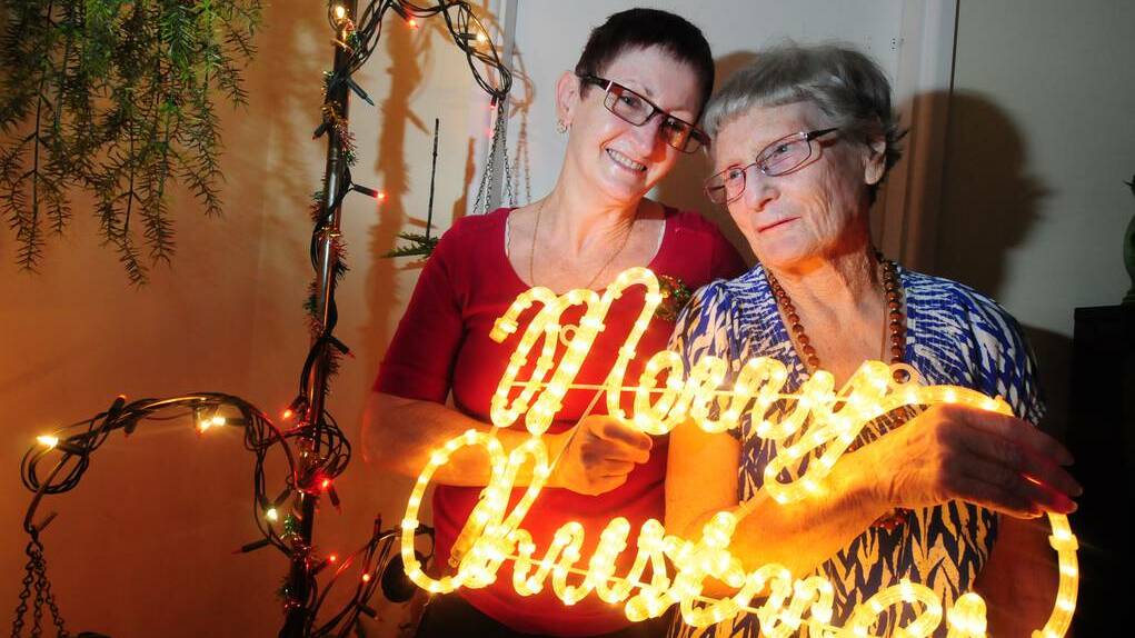 DUBBO: Sharon Hobson with her neighbour Marjorie Griffiths enjoy the Christmas spirit. Photo: LOUISE DONGES