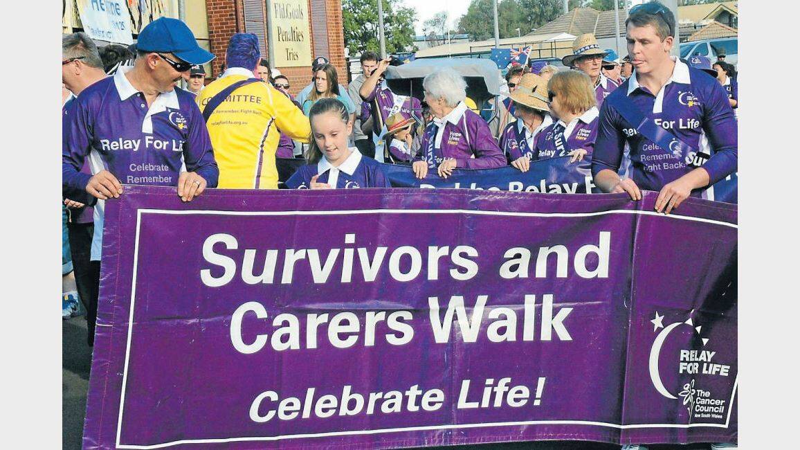 SEPTEMBER: More than 50 teams, including Rod and Ava Smith and Brent Groves, came together in a continuous walk for 24 hours to help raise a total of $78,000 during the Dubbo and District Relay for Life. Photo: HOLLY GRIFFITHS