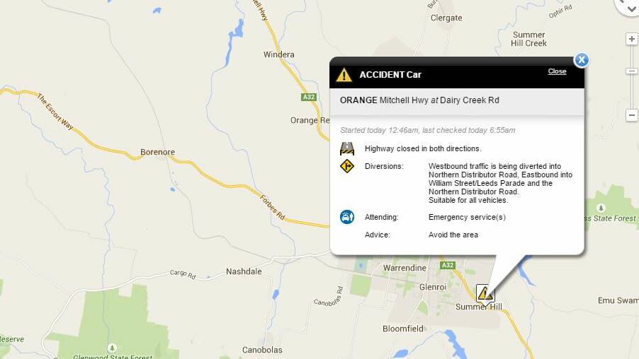 Mitchell Highway closed after police car collides with crashed vehicle.