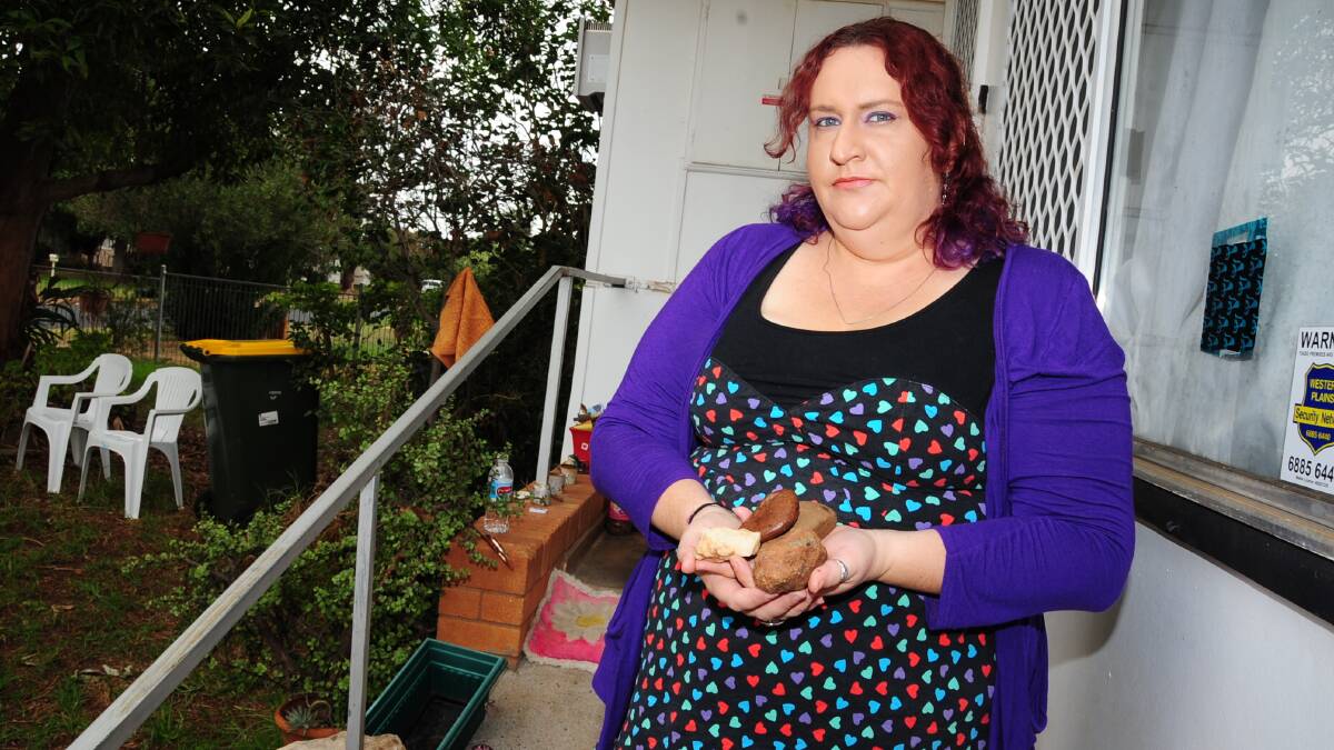 Katie Hall says she has had rocks thrown into her yard before, but it was the slingshot projectile smashing a window near her children that has made her most angry. Photo: JOSH HEARD