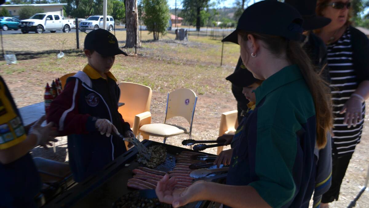 Scouts and Girl Guides at the Scout Hall in Wellington serving up election day snags. Photo: WELLINGTON TIMES