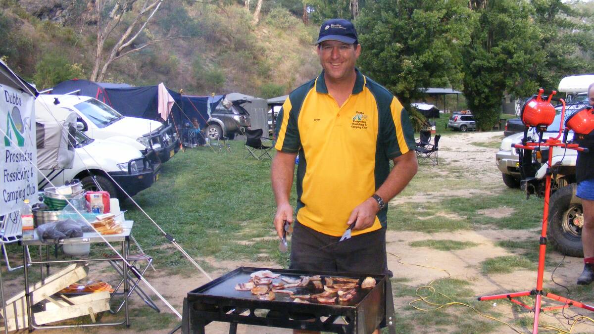 One of the many summer camping trips taken by the Dubbo Prospecting, Fossicking and Camping Club. Starting up the barbecue for breakfast.  Photo: Brian Walters