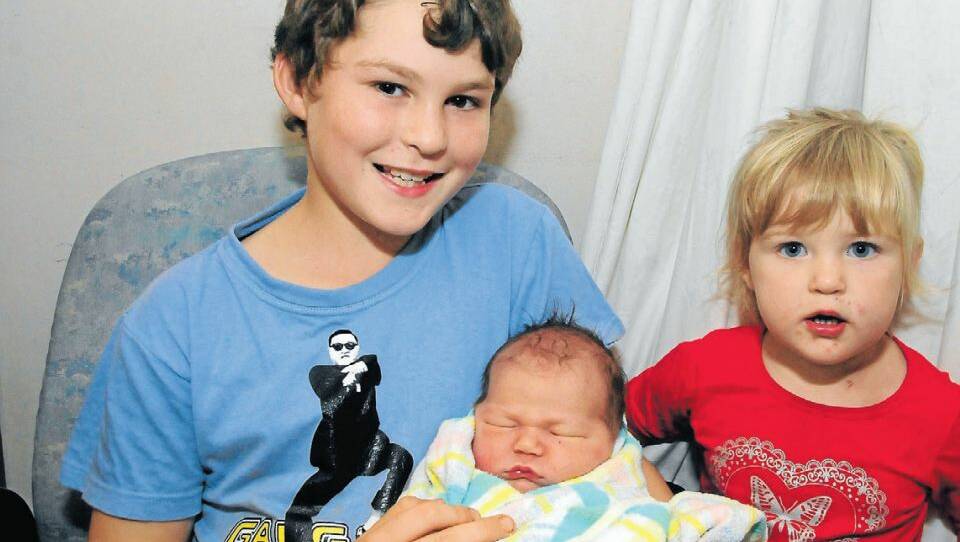 MARCH 28: Abbie Lucas (held by uncle Riley Cook and pictured with sister Claire Lucas, is a daughter for Jeremy Lucas and Sarah Cook of Wellington. 