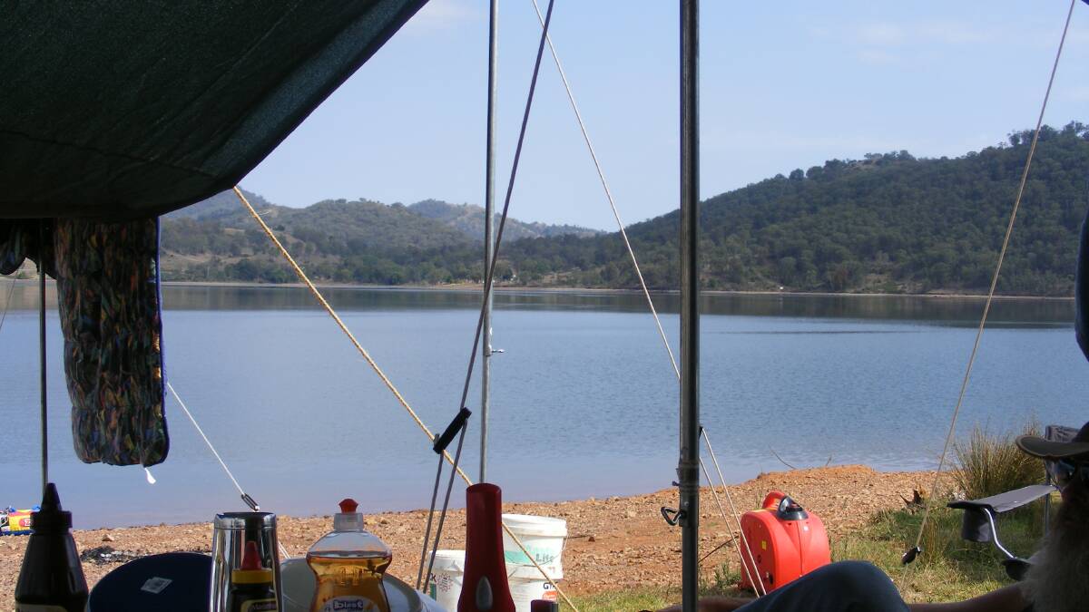 One of the many summer camping trips taken by the Dubbo Prospecting, Fossicking and Camping Club. The view from the tent at Chaffy Dam near Nundle. Photo: Brian Walters