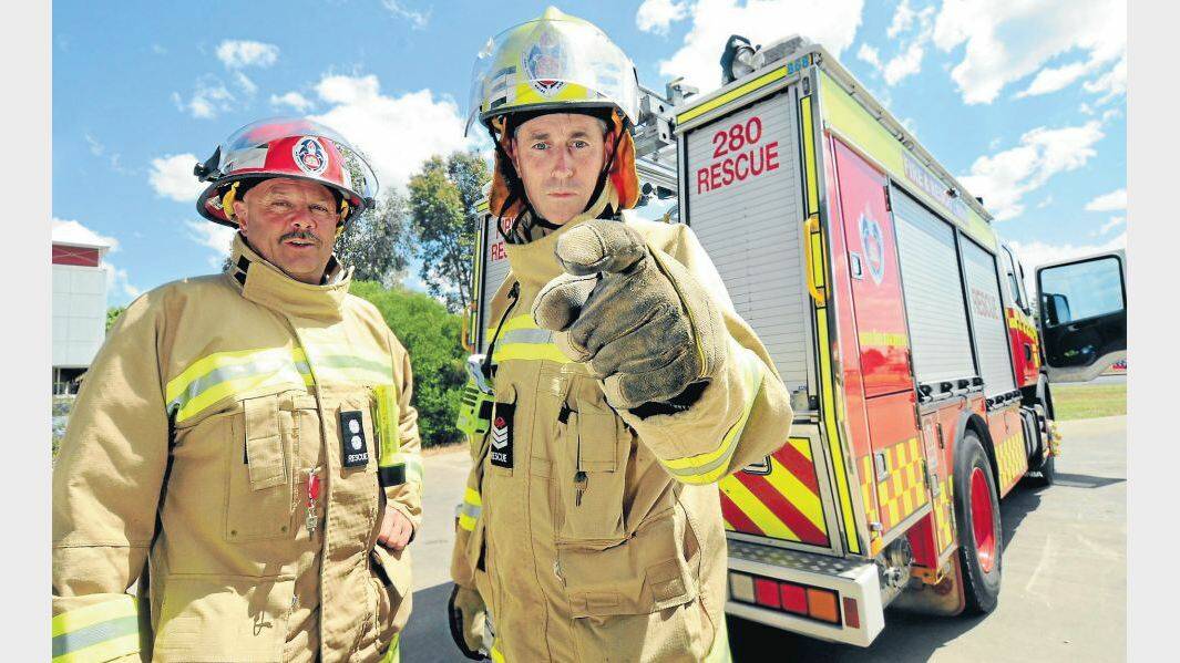 NOVEMBER:  Station officer at Fire and Rescue NSW's Dubbo Fire Station Glenn Kimpton and senior firefighter Scott Habgood make their point about fires started by "malicious and careless" behaviour.
Photo: LOUISE DONGES