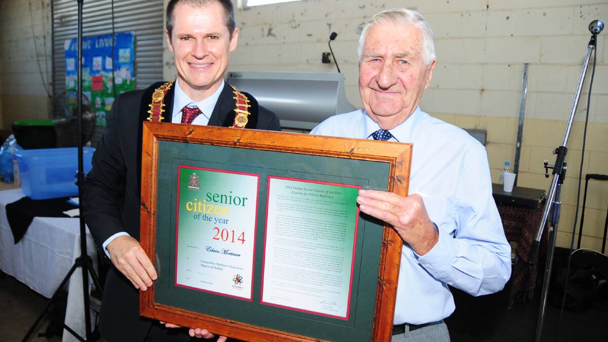 Dubbo mayor Mathew Dickerson congratulates Ted Mortimer on being named 2014 Senior Citizen of the Year. Photo: BELINDA SOOLE