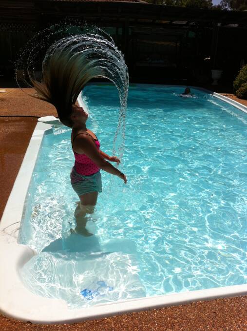 Laura enjoys the summer heat at her nan and pops house. Photo: Lynda Egan. 
