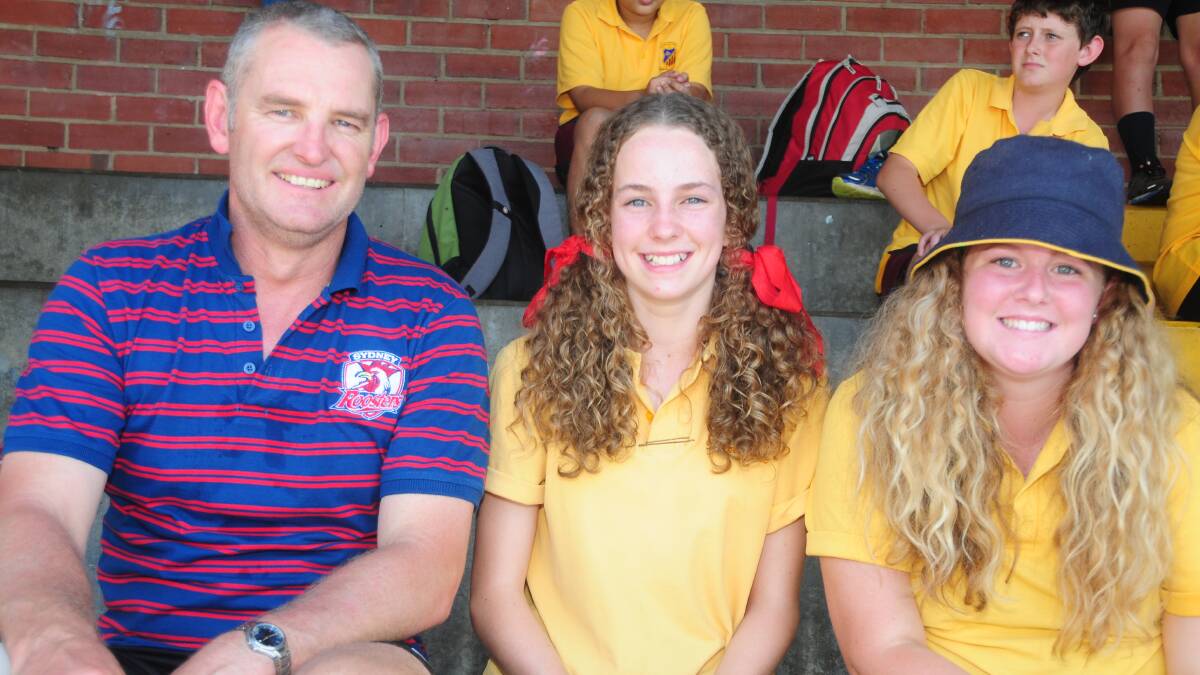 ST JOHN'S COLLEGE:  Gerard Lushan with Grace Dunn and Emily Bush. Photo: LOUISE DONGES. 