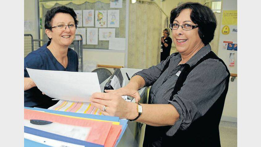 MAY: Newly-appointed director of nursing at Dubbo Base Hospital Jenny Johnson (right) confers with Carol Falcioni, nurse unit manager for day surgery. Photo: BELINDA SOOLE