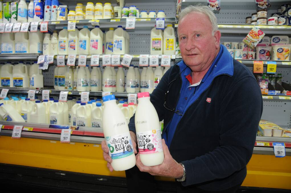 West Dubbo IGA manager Tony Codner with bottles of milk from the Little Big Dairy Company. The independent retailer was the first store in Dubbo to stock milk from the family-owned local business. Photo: FAYE WHEELER