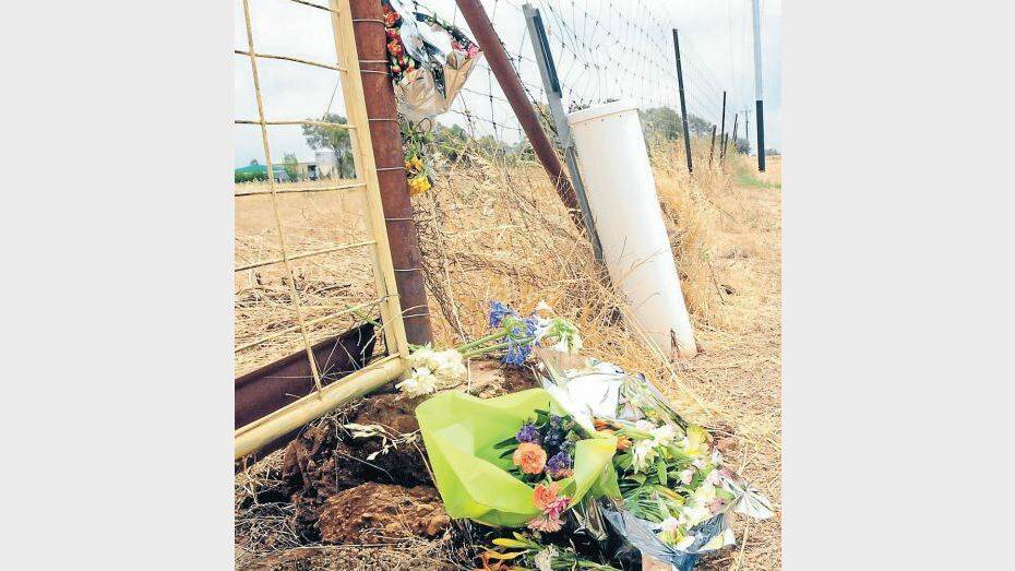DECEMBER: Flowers left by friends and family at the site of the accident where a 16-year-old youth died on Old Dubbo Road. Photo BELINDA SOOLE