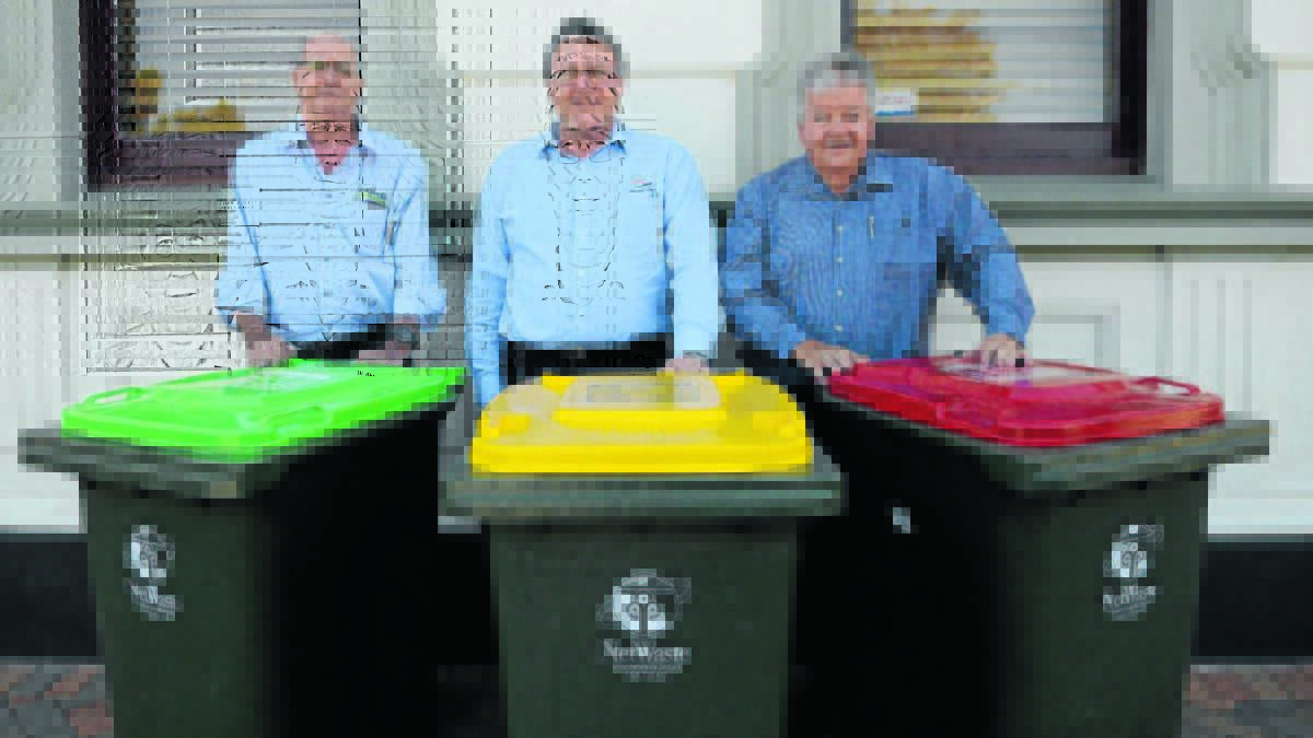 Stephen Allcock from JR Richards and Sons, Forbes Shire Council's Paul Bennett and Greg Turner from JR Richards and Sons with the new bins.