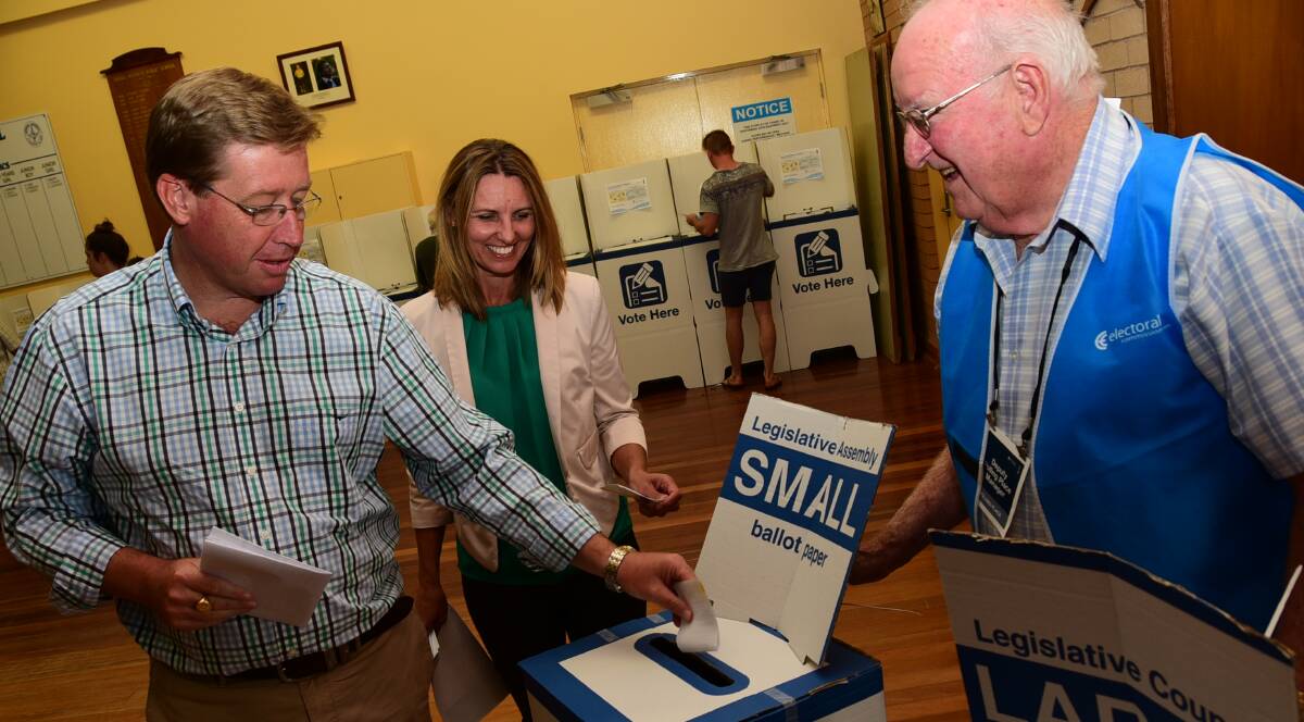 Troy Grant, Toni Grant and polling manager Barry Grady. Photo: JOSH HEARD