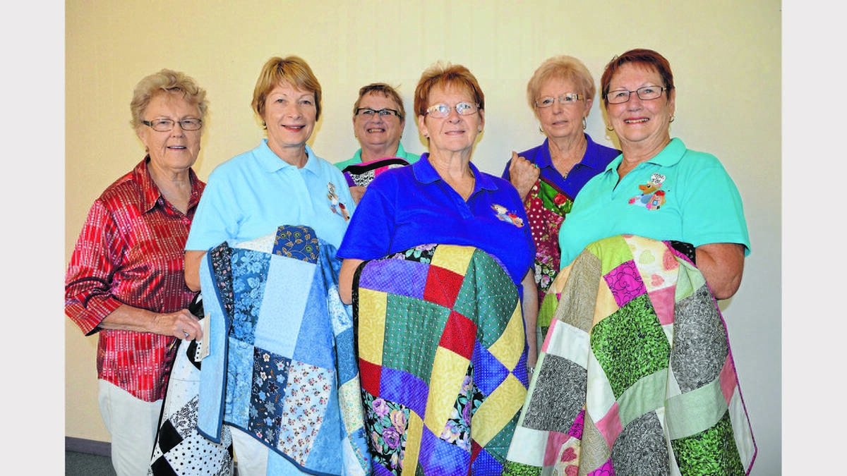 PARKES: The quilters with their work - from left, Kitty Dwyer, Fran Dixon, Bev Thompson, Bev Purcell, Rhona Went and Colleen Flynn. Photo Barbara Reeves