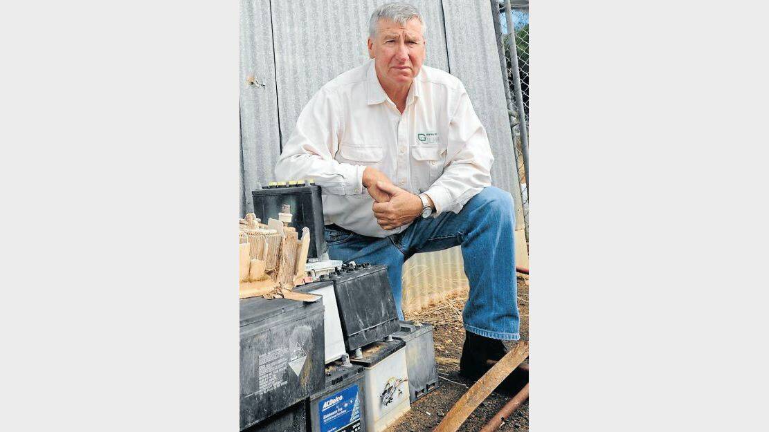 JUNE: Central West Livestock Health and Pest Authority ranger Scott Sullivan with batteries found dumped at the Mugga Hill reserve in Dubbo. PHOTO: BELINDA SOOLE
