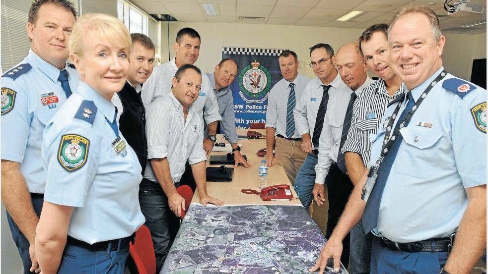 APRIL: Commander Jodie Shepherd, Detective Inspector Rod Blackman, Detective Senior Constables Matt Martin, Troy Andrews, Paul Wilks, Daniel Ducksworth, Adam Macdougal, Scott Blanchard,
Phil McCloskey, Paul Kelly and Assistant Commissioner Geoff McKechnie at a debriefing at the conclusion of an operation targeting illegal pig hunting and rural crime. Photo: LISA MINNER