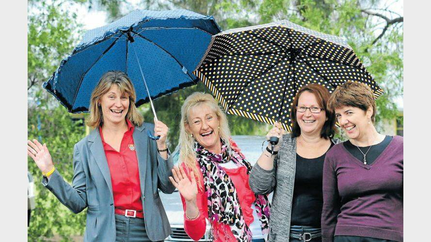 MAY: Practically singing in the rain in Dubbo were Karen Paxton, Jay Symons, Lisa Riley and Rebecca Ivers. Photo: LOUISE DONGES