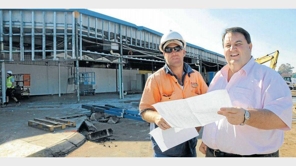 MAY: Terry Jones of the MAAS Group and general manager of The Bachrach Naumburger Group Steve Gooley confer on the expansion of retail space on the southern side of the Orana Mall.
Photo: BELINDA SOOLE