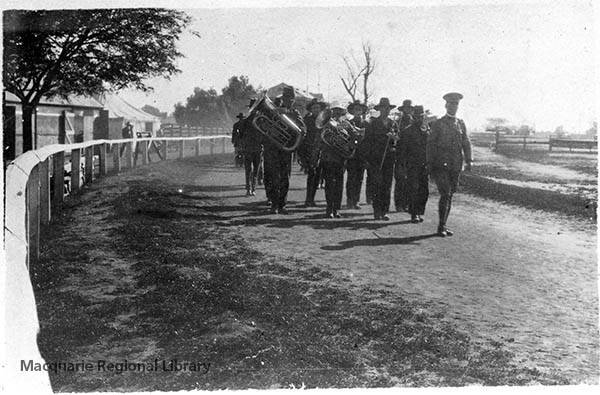 A group of soldiers with several brass instruments marching on the race track at Dubbo Army Camp in 1916.  PHOTO: MACQUARIE REGIONAL LIBRARY