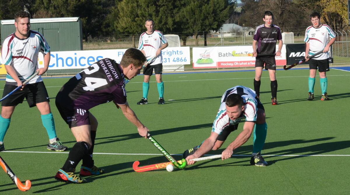 SHUT DOWN: Bathurst City's Blake Davis tackles Lithgow rival Joss Luka in the first half of Saturday's men's Premier League Hockey match. Photo: PHILL MURRAY 062516ppanthers5