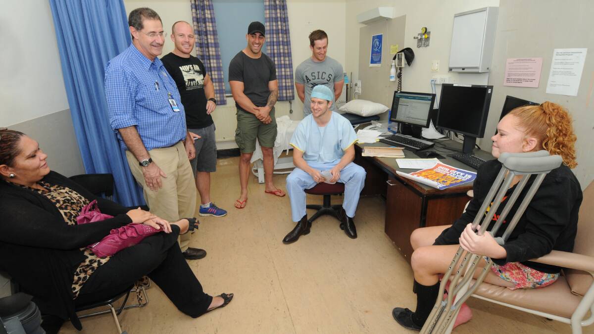Country rugby league players visit Dubbo Hospital.Left to right, Kelly Dennis of Walgett, Director Medical Services Dr Randall Greenberg, Scott Campbell, Orthopaedics and Jamilla Dennis who broke her foot recently.  Photo: Louise Donges