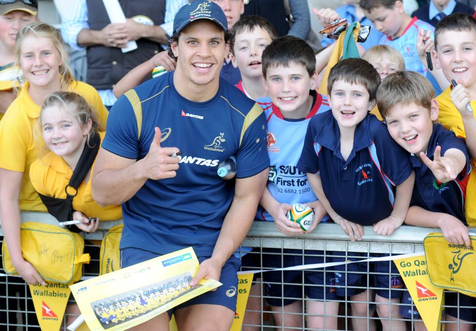 Wallabies player Matt Toomua with Phoebe Lamph, Lily Veech, Hamish and Eamon Fitzgerald and Lachlan Galante. 					       Photo: LOUISE DONGES