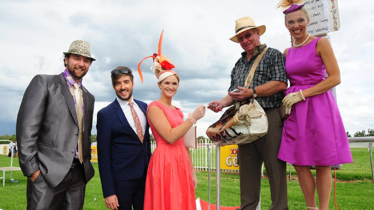The Wellington Boot brought out would-be fashionistas to take home the spoils in the best dressed stakes. Peter Giorgiutti (best shirt), Wellington's Paul Rich (best dressed male), Kirsty Colliver (best dressed female under 30) and overall winner Jac Emery (far right) with bookie Peter Orbell.  Photo: CHERYL BURKE