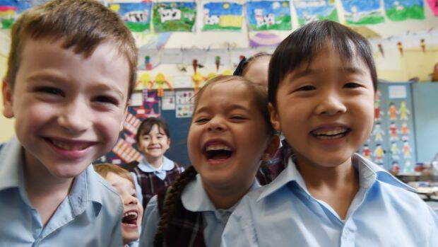 Kindergarten students enjoying a laugh. A child disinclined to join in could have signs of psychopathic traits.  Photo: Nick Moir