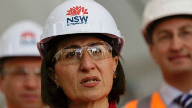 Premier Gladys Berejiklian, in a hard hat bearing the NSW government waratah logo. Photo: Brook Mitchell
