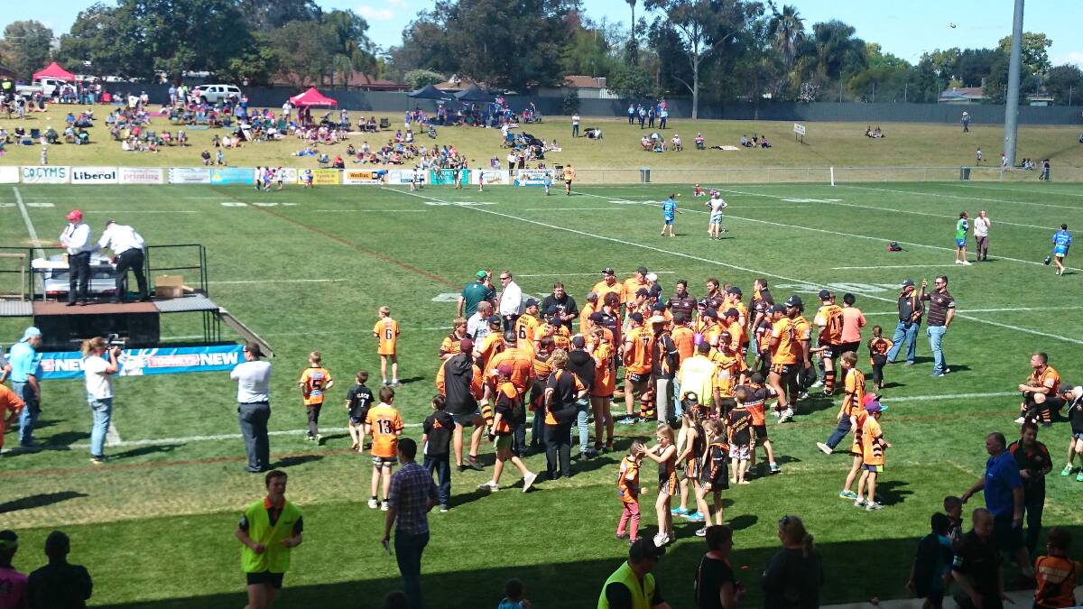 Nyngan's team and supporters celebrate their reserve grade grand final win.
