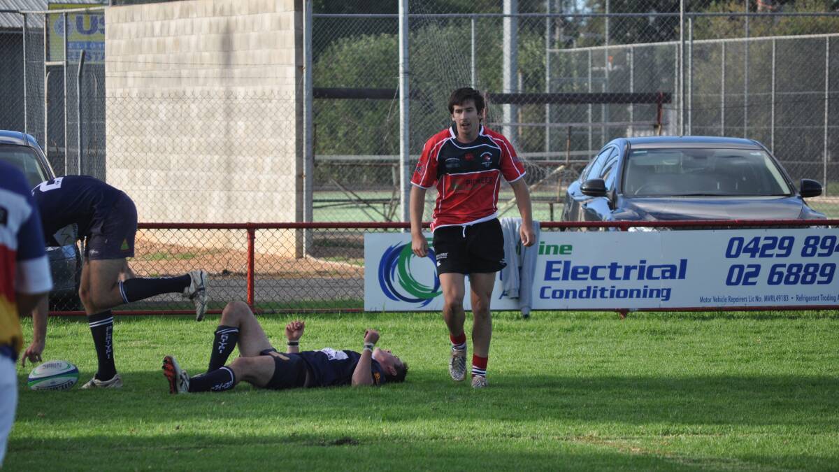 RED'S THE WINNER: Narromine Gorillas' Chris Light leaves the Forbes Platypi  defence in his wake after scoring a try. Photo: BEN WALKER