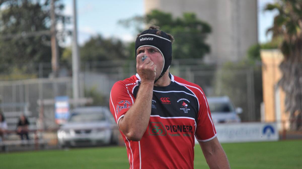 DEEP BREATH: Narromine Gorillas' Lachie McCutcheon attends to a small dose of asthma on the field. Photo: BEN WALKER