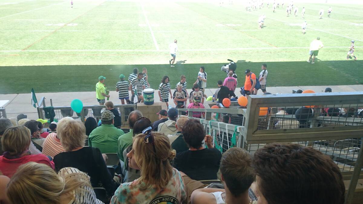 CYMS and Forbes players head up the tunnel for half-time in the under-18s grand final.