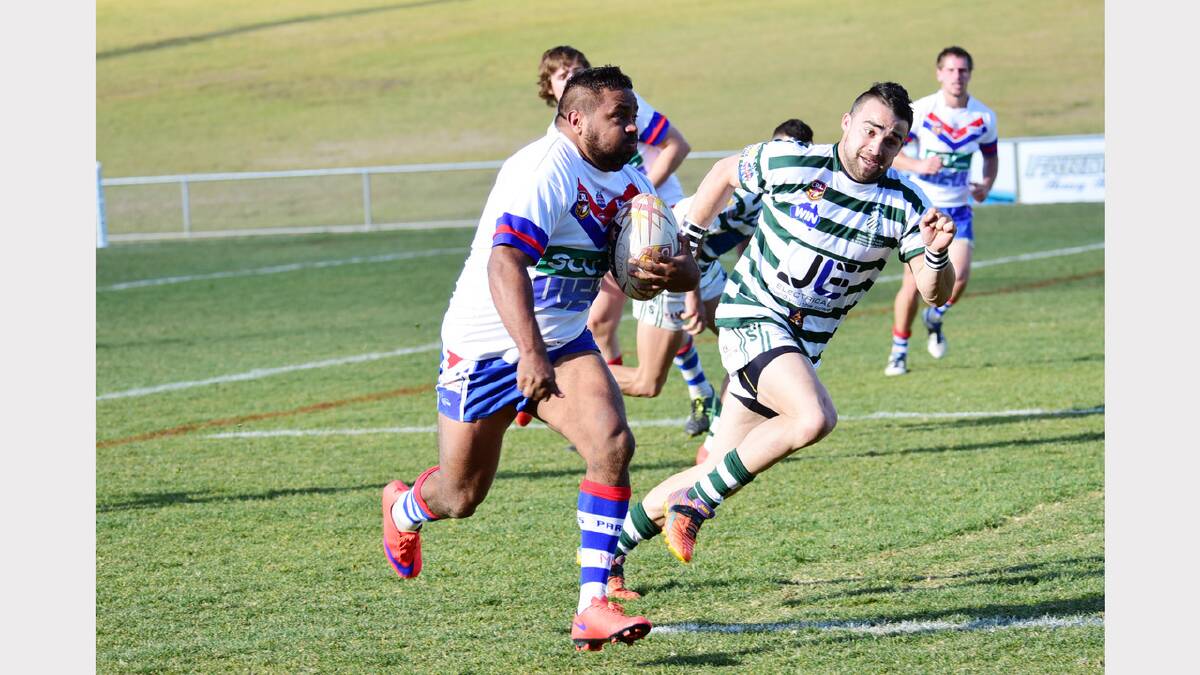 Parkes’ Michael Mitchell makes a break,  chased by Cyms Scott Burgess.