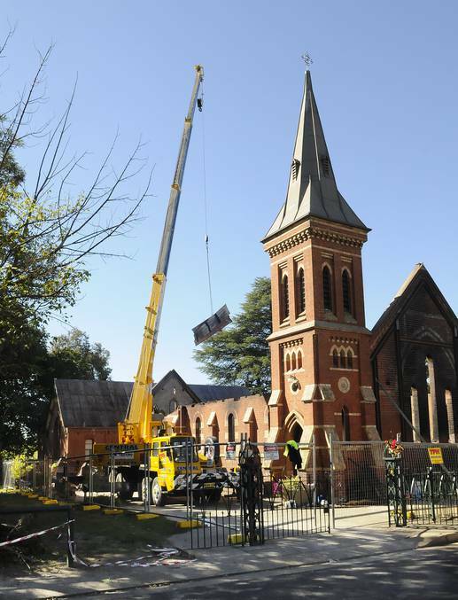 BATHURST: A crane removes parts of the collapsed roof from inside St Barnabas’ Anglican Church. Photo PHILL MURRAY 031914pbarnabas