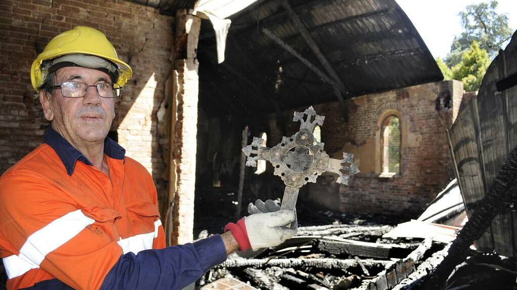 BATHURST: Tony Cafe from T.C. Forensics with one of the holy relics he found during his assessment of the ruins of St Barnabas' Anglican Church. 