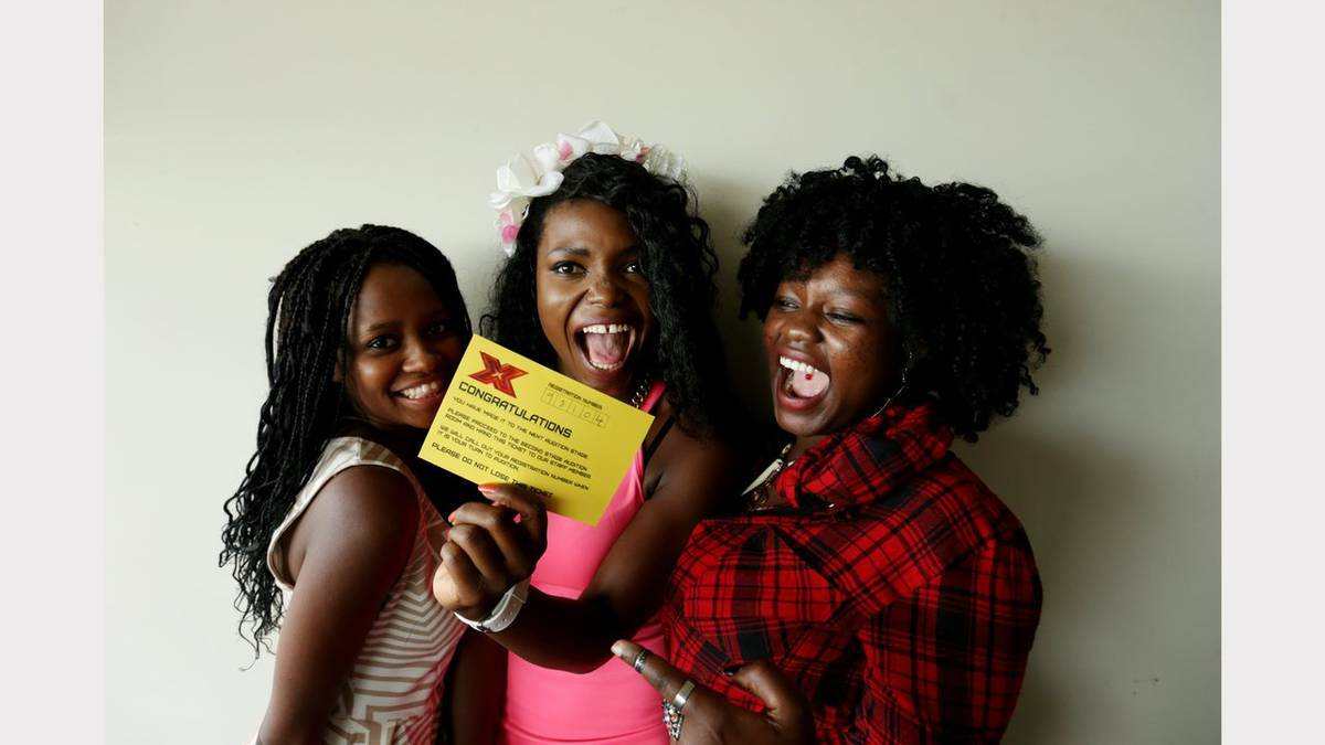 The X Factor Newcastle audtions at Hunter Stadium. Blessing Bless of Muswellbrook celebrates with friends from left Cherley Hambira of Sydney and Anne Hinga of Newcastle getting through her first audition. Picture: Simone De Peak