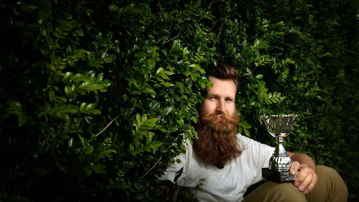LUSH GROWTH: The Newcastle Herald's own photographer, Max Mason-Hubers won the NSW Best Full Beard award at the Inaugural Beard and mustache championships held at Bar 121 in Lambton on Sunday. Photo by Marina Neil