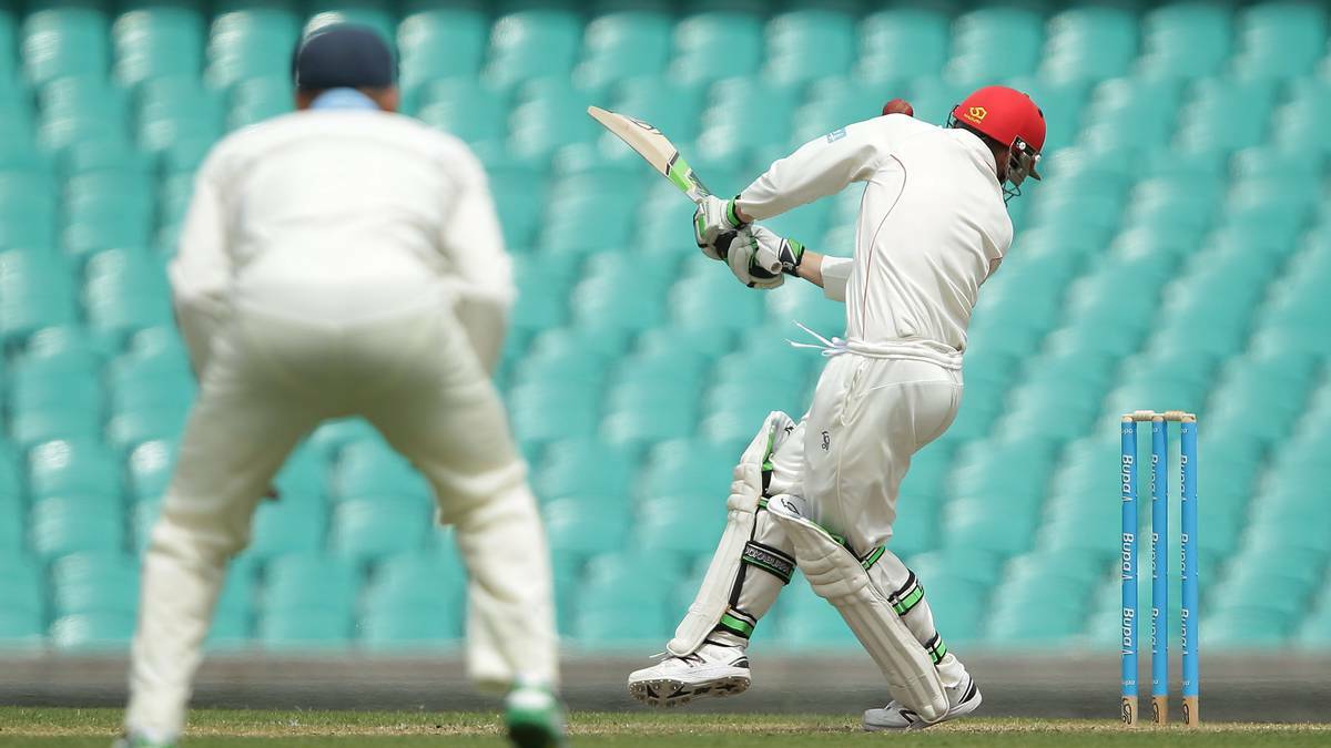 The moment of impact: Hughes is struck under the left ear. Photo: Getty Images