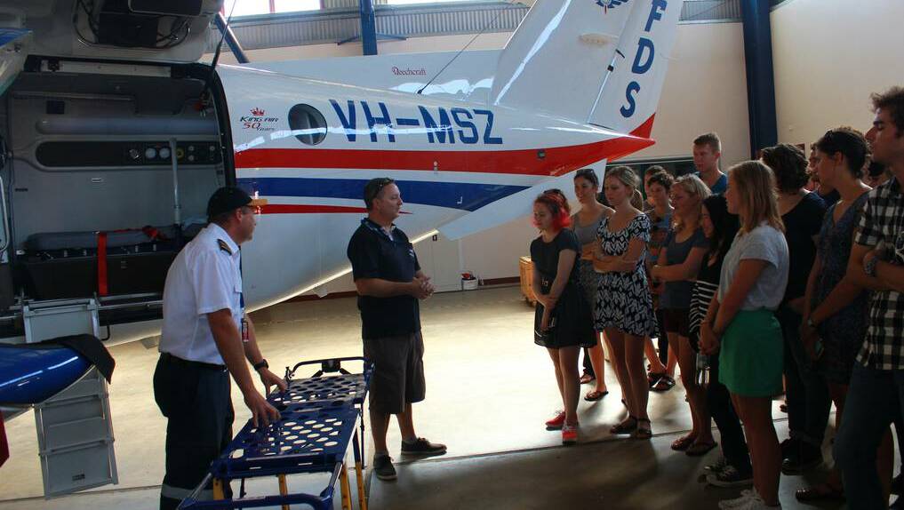 RFDS Dubbo Base Manager Darren Schiller and RFDS pilot Captain James Brown demonstrating the features of the plane to the University of Sydney medical students.
