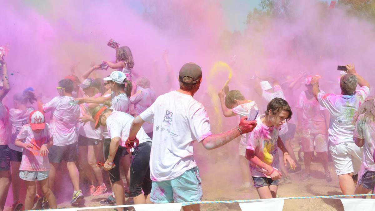 Participants in the inaugural Dye Hard Fun Run added a blast of colour to their weekend and braved the heat during the 5km event. Photo: CHERYL BURKE 