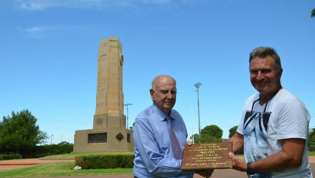 Bucky Tink and John Van Der Reyden with the plaque. Photo: JENNIFER HOAR