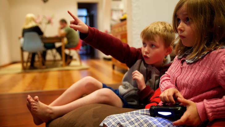 Liam Hunter, 9, and Eve Hunter, 6, play Minecraft at their Leichhardt home. Photo: Wolter Peeters