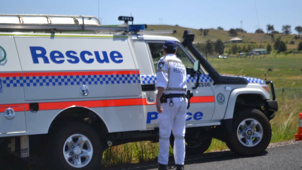 An officer from the NSW Bomb Squad together with a constable from Wellington Police secured two explosive devices near the railway line at Mumbil. Photo: FARREN HOTHAM