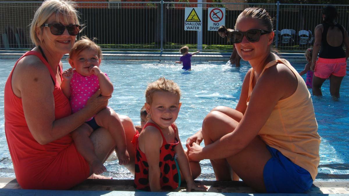 Yvonne Hoffman with Indi, Willow and Alanna Payne cooling off at the pool.