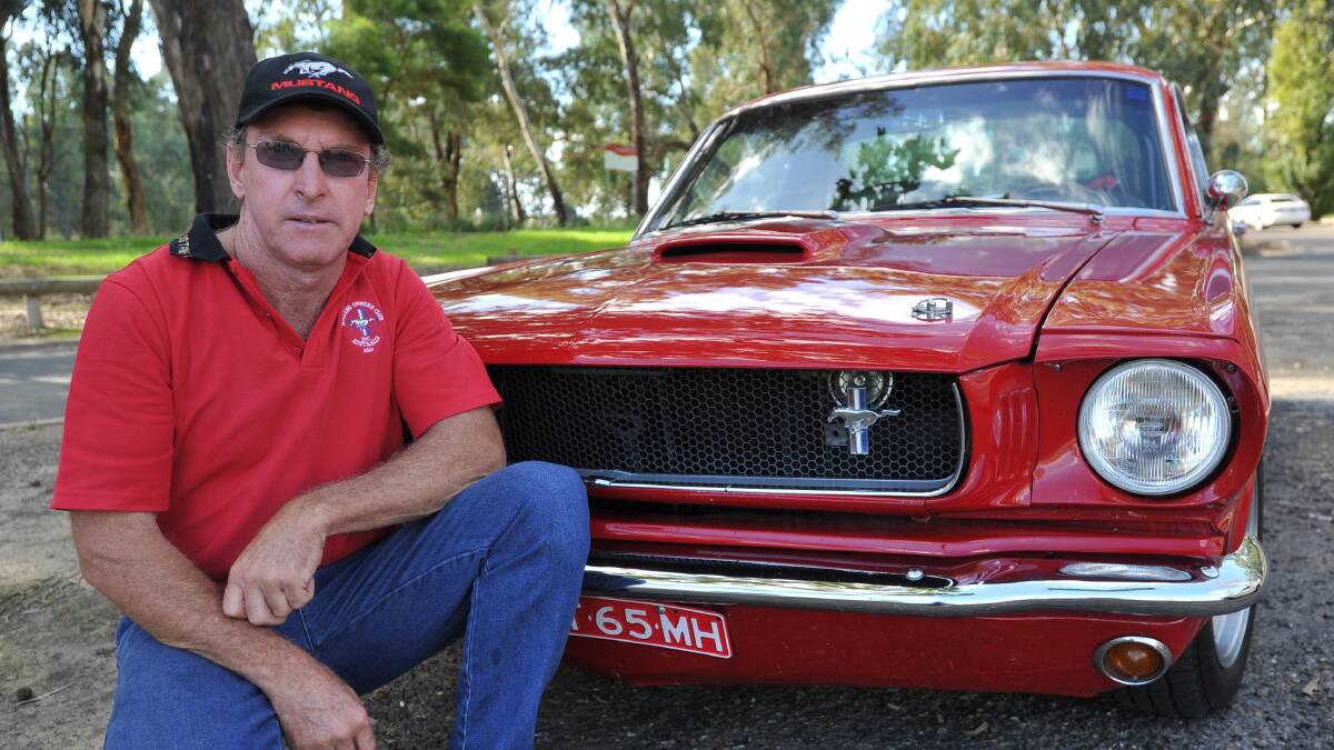 RED BEAUTY: Mick Hall, with his beloved 1965 FastBack GT350, is hoping Mustang lovers in the Riverina will join the club on Sunday. Picture: Laura Hardwick
