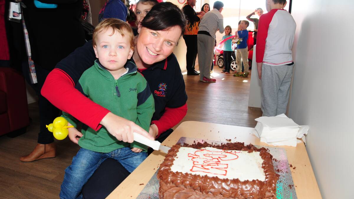 Aiden McCarthy and Deanna McCarthy tucking in to some cake. 
Photo: CHERYL BURKE  