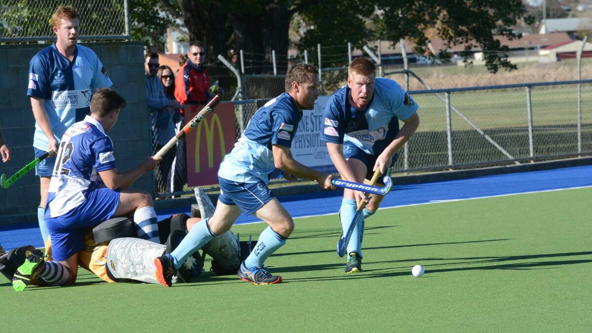 KEEP THEM COMING: Jono Bailie, Andy Cranston and their Souths team-mates have had their time to celebrate their win over St Pat’s last men’s Premier League Hockey round. They now must produce the same level to overcome competition leaders Lithgow Panthers today. Photo: PHILL MURRAY 051416psouths2